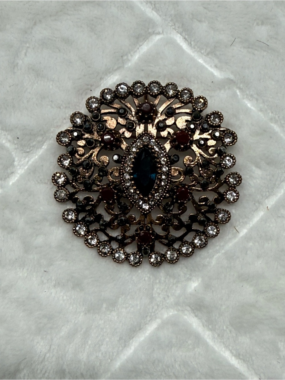 Vintage-Style Gold Filigree Brooch with Blue and Clear Stones